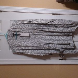 A gray and white pull over